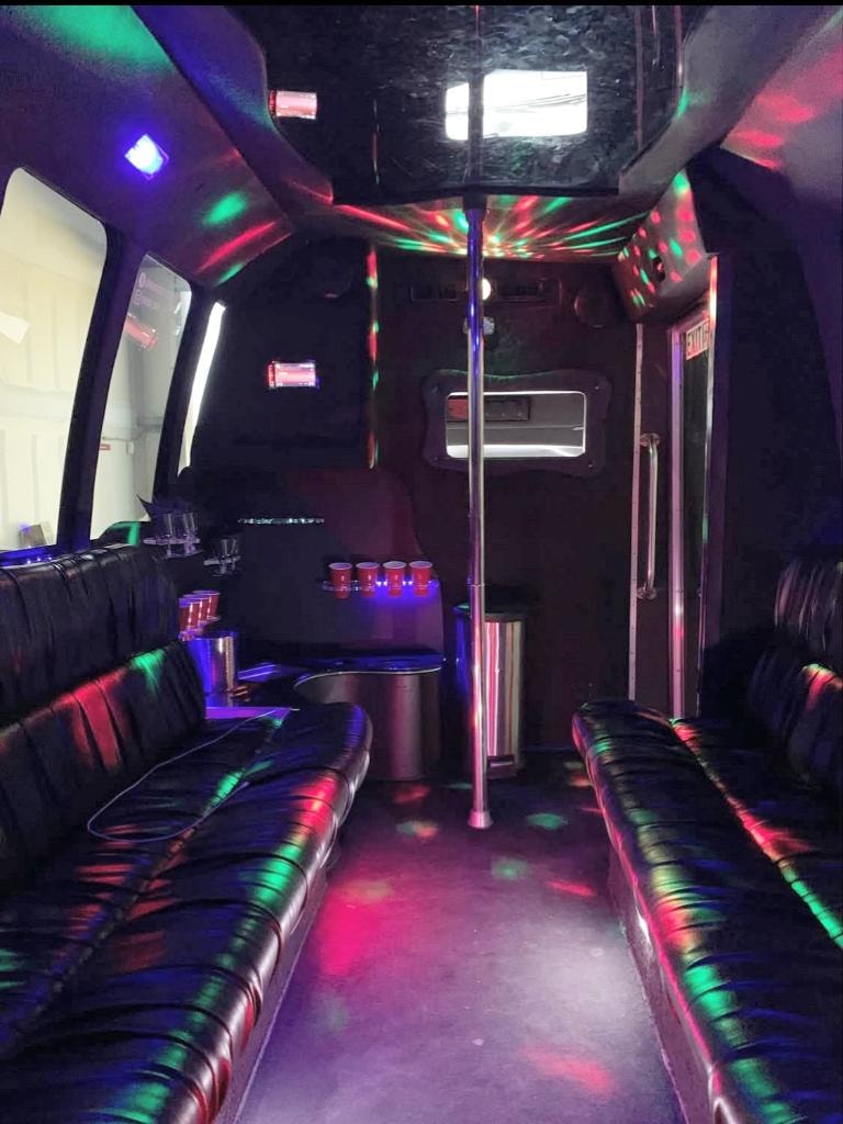 RRx2 party bus full interior view with luxury wood floors and seating