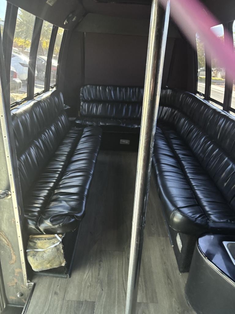 RRx2 party bus black leather seating with chrome accents